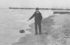 Robert Smith (not Dr. Bob) points to the place where he found the murdered body at Euclid Beach, aphoto from the Cleveland Plain Dealer